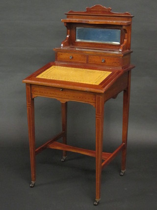 An Edwardian inlaid mahogany Davenport the raised back fitted  a pen recess and 2 short drawers, raised on square tapering  supports with H framed stretcher 21" œ