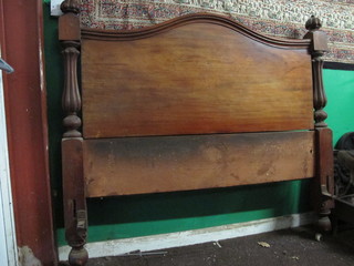 A 19th Century French mahogany headboard with turned and  fluted decoration, 60"