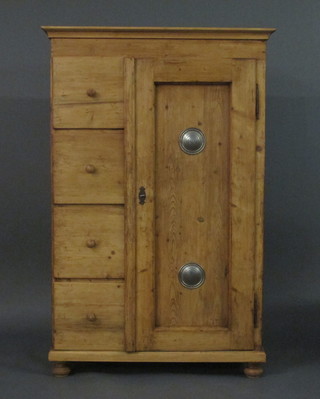 A Continental combination pine cabinet with moulded cornice, fitted a shelved cupboard enclosed by panelled doors, the side  fitted 4 long drawers, raised on bun feet 40"