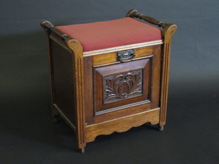 An Edwardian walnut piano stool with carved fall to the front