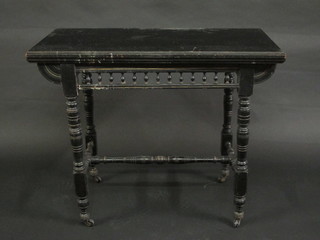 An Arts & Crafts aesthetic movement rectangular ebonised card  table with bobbin turned decoration, raised on turned supports  with H framed stretcher 36"