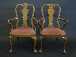 A pair of Queen Anne style walnut slat back dining chairs with upholstered drop in seats, raised on cabriole supports