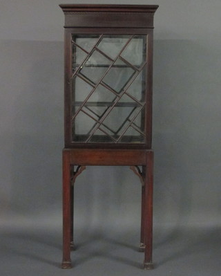 A Georgian rectangular mahogany free standing display cabinet  with moulded and dentil cornice, fitted adjustable shelves  enclosed by astragal glazed panelled doors, raised on square  supports 24"