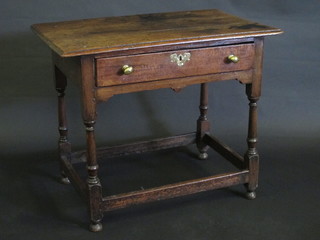 A 17th/18th Century oak side table fitted a drawer with brass handles, raised on turned and block supports with box framed  stretcher 34"  ILLUSTRATED