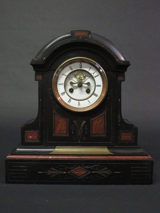 A Victorian French 8 day striking mantel clock with visible escapement, enamelled dial and Roman Numerals, contained in  an arch shaped marble case
