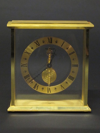 A Jaeger Le Coutre mantel clock with gilt dial and visible movement, contained in a gilt case, 6"  ILLUSTRATED