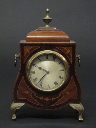 A bedroom timepiece with silvered dial and Roman numerals  contained in an inlaid mahogany case