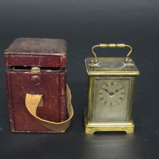 A 19th Century 8 day carriage clock with silvered dial contained in a brass case, complete with leather carrying case   ILLUSTRATED