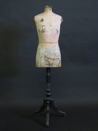A 19th Century papier mache mannequin on a turned wooden  stand