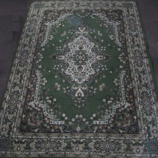 A green ground machine made Persian style carpet 108" x 78"