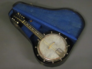 An 8 stringed Ukelele banjo with 10" drum, cased
