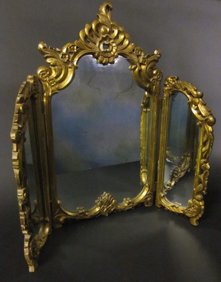 A 19th Century triple plate dressing table mirror contained in a decorative gilt frame