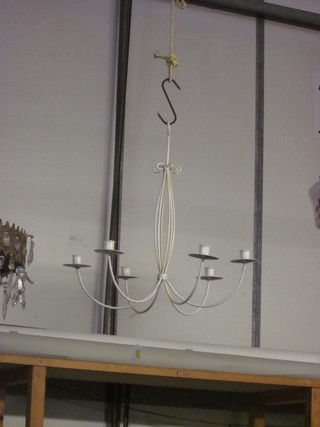 A white painted wrought iron 6 light chandelier