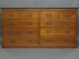 An aesthetic movement walnut double chest fitted 4 short drawers above 4 long drawers, raised on a platform base 88"