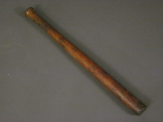 A turned wooden club