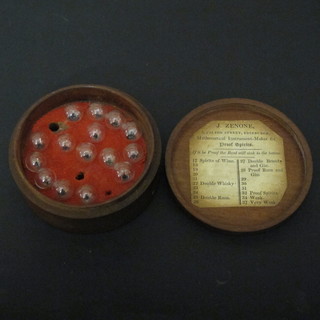 A J Zenone hydrometer set containing 15 spherical glass balls contained in a turned wooden case