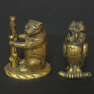 A 19th Century brass table vesta case in the form of a standing chained bear and 1 other in the form of an owl, 1 eye missing, 2"