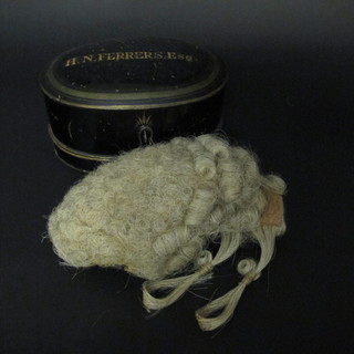 An oval Japanned legal wig box with hinged lid marked H N  Ferrers complete with horse hair wig  ILLUSTRATED