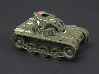 A Japanese clockwork tin plate model of an American tank, back missing