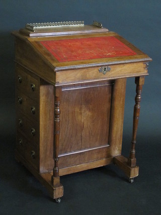 A Victorian mahogany Davenport, the top with three-quarter  gallery, the pedestal fitted 4 long drawers, raised on turned  supports 21"
