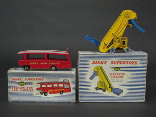 A Dinky Supertoys trailer and car carrier no. 985, boxed together with a Dinky Super Toy elevator loader no.964, boxed