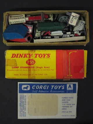 2 Dinky Toys standard lamps no. 755 together with a collection  of various street furniture including petrol pumps, road signs etc