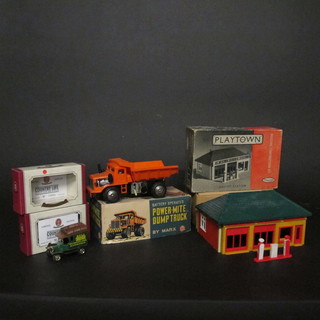 A Marx battery operated Power-Mite dumper truck together with  a Play Town service station and 2 Oxford die cast models