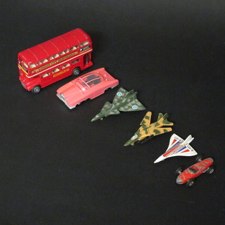 A model of a London double decker bus and a small collection of toys