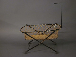 A 19th Century childs oval metal cot 26"