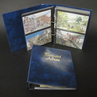 2 blue loose leaf albums of modern postcards