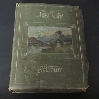 A green card album of various postcards