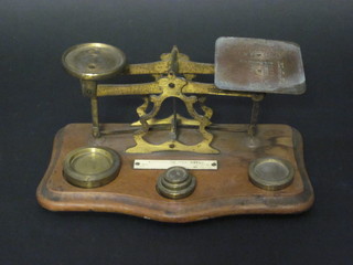 A pair of wooden and brass letter scales