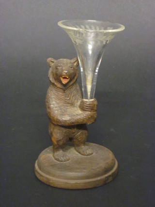 A Swiss carved wooden bear 4 1/2" fitted a cut glass vase, chip  to vase,