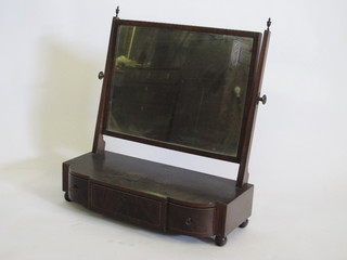 A rectangular Georgian plate dressing table mirror contained in a mahogany frame raised on a shaped base, fitted 1 long and 2  short drawers, raised on bun feet 23"