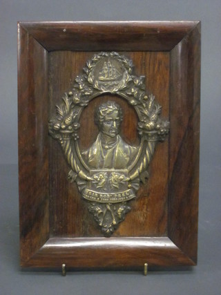 A gilt metal plaque depicting Sir Robert Peel, contained in a rosewood frame 9" x 7"