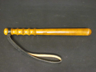 A turned wooden truncheon