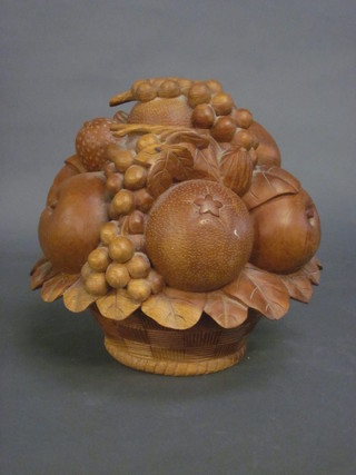 A wooden sculpture in the form of a basket of fruit 7"