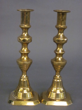 A pair of 19th Century brass candlesticks with knopped stems  10"