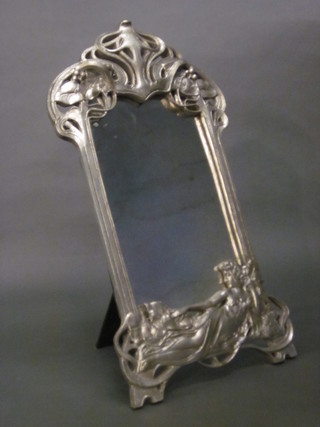 An Art Nouveau style easel table mirror contained in a resin frame decorated a lady 19" x 9"