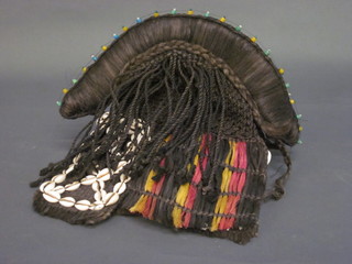 An Eastern shell and fabric tribal mask