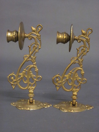 A pair of pierced brass Art Nouveau candle sconces