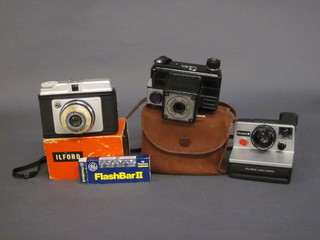 An Iford Sporti Roll camera, a Cornet Popular Twelve and a  Polaroid Pronto! B10