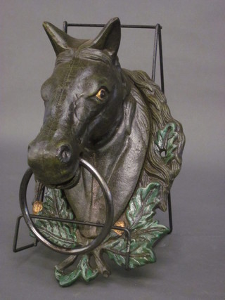 An iron towel ring in the form of a horses head 12"