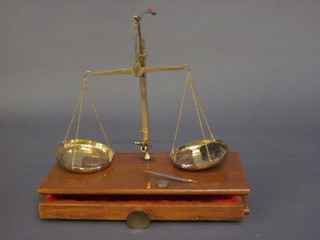 A pair of brass and mahogany gold scales, cased