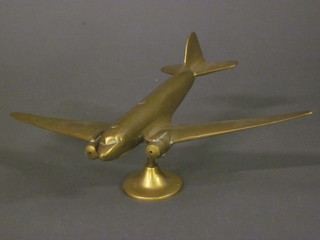 A brass model of an aircraft in flight 15"