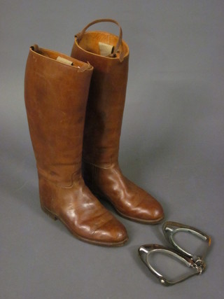 A pair of brown leather riding boots by Flights Ltd of New  Burlington Street together with a pair of metal spurs