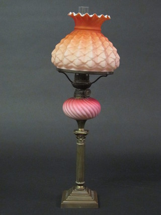 A Victorian opaque pink glass oil lamp reservoir and shade,  shade f, raised on a brass column with Corinthian capital