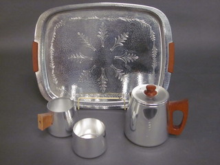 A Sona stainless steel 4 piece tea service comprising twin handled tea tray, hotwater jug, cream jug and sugar bowl