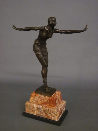 A bronze Art Deco style figure of a dancing girl, raised on a rectangular stepped marble base 19"