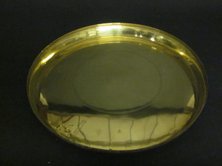 A circular brass charger 18"